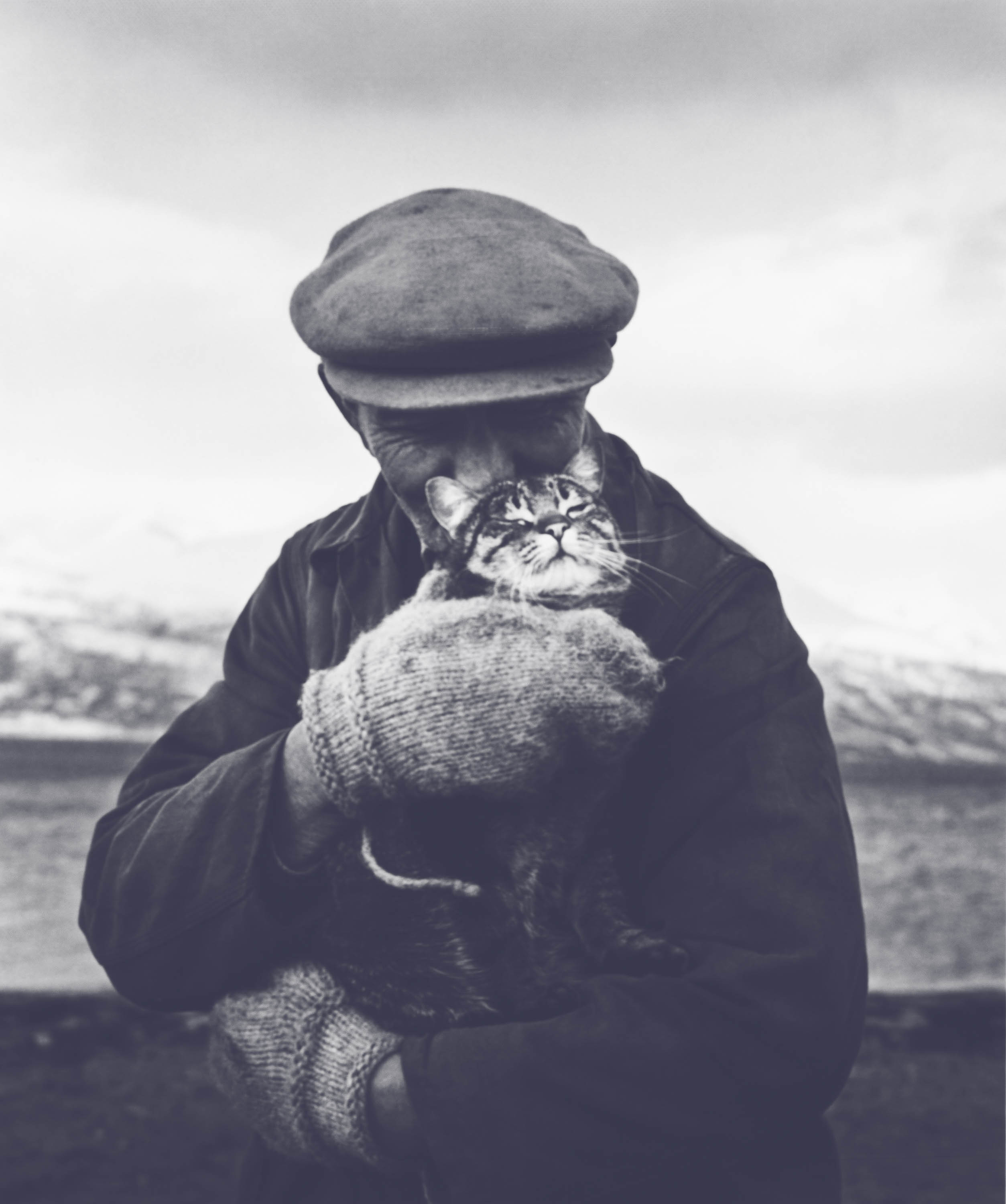 EVERYDAY-happy-warm-man-cat-hugging-slate.jpg