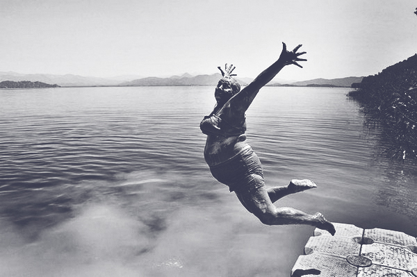 JOYFUL-old-woman-jumping-into-water-slate.jpg